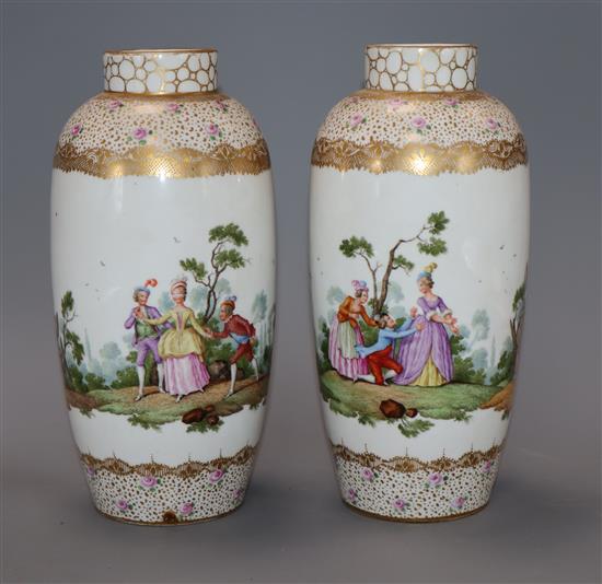 A pair of Dresden Augustus Rex style vases, decorated with ladies and gentlemen